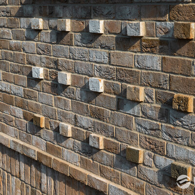 Tehlový obklad Zandlicht na fasáde a plote rodinného domu